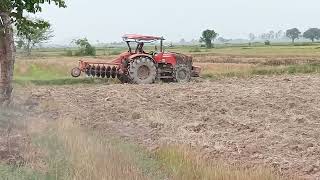 An Amazing Kubota Tractor Plows Ground. ត្រាក់ទ័រភ្ជួរស្រែ.