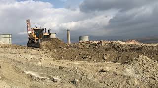 Caterpillar D9T And Komatsu D275AX Bulldozers Ripping And Pushing