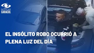 Cámara captó cómo dos ladrones en Bogotá se llevaron el computador de un carro