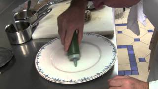 Michel Roth prepares a dish at Ritz Paris