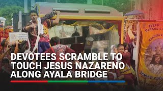 Devotees scramble to touch Jesus Nazareno along Ayala Bridge | ABS-CBN News