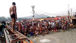 Men jumping in Ganga River at Haridwar Har Ki Pauri Ghat . Crazy Water Speed and Whirlpool