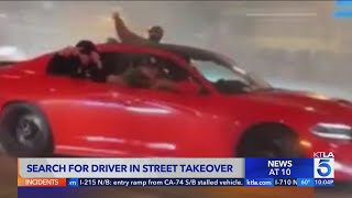 LAPD seeks driver involved in street takeover with stolen vehicle
