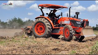 Tractor Kubota M7040 Tractor Ploughing Land Field - Farmers Plowing Dirt Using Tractor Kubota M7040