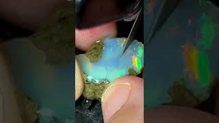 Opal mined deep in a mountain exposing explosive colors let's look.