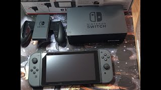 Unboxing Nintendo Switch revision 2 Gray.  Gift to a friend. His first console.