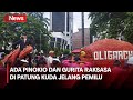 Mahasiswa-Buruh Demo Bawa Boneka Gurita dan Pinokio Raksasa di Patung Kuda