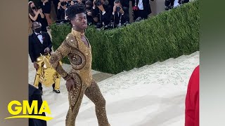 Watch Lil Nas X transform into his gold bodysuit at the MET Gala l GMA