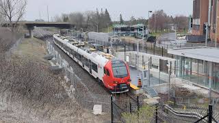 O Train Line 2 - FLIRT arrives at Mooney's Bay in light rain