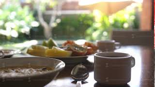 Healthy delicious breakfast with tropical fruit and oat porridge with cupof coffee on vacation time