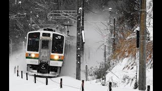 211 local train running in a heavy snowfall