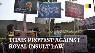 Thai demonstrators gather near UN office calling for action against royal insult law