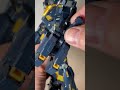 how to deploy the beam tonfa on the left arm of the mg unicorn gundam 2nd banshee.