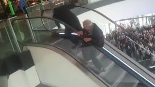 ESCALATOR FAIL: Polish men fall upstairs many times