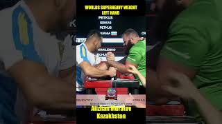 Alizhan Muratov writes armwrestling history winning Superheavy weight World Championship on left