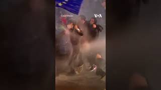 Protesters in Georgia Shield Woman Waving EU Flag #shorts | VOA News