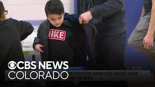 Denver firefighters help keep kids warm this winter