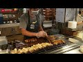 the most popular street food barbecued king oyster mushrooms booth in shilin night market taiwan.