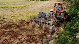 Uphill/Downhill - Kubota Farmer in Philippines with M9540 attached with Trailing harrow / Stable