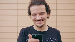 Happy Man Using A Smartphone Stock Video