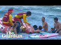 Athletes rush to save 25 swimmers stuck in rip, after surf competition in Maroubra