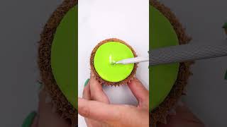 Our favorite buttercream carving hack transforms a cupcake into a kiwi!