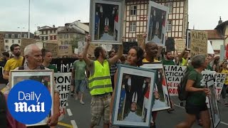 Critics of Emmanuel Macron march in a town near G7 summit