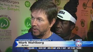 Mark Wahlberg attends Wahlburgers grand opening