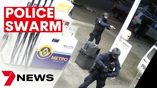 Police swarmed a Chullora service station with their weapons drawn to arrest Sydney man | 7NEWS