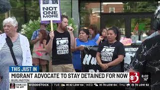 Migrant advocate to remain detained for now
