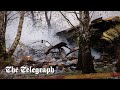 DHL cargo plane crashes into house killing at least one