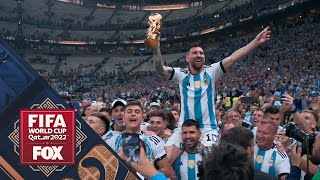 Lionel Messi is carried through the stadium after Argentina wins the 2022 FIFA World Cup final