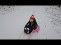 pulling a boy through snow