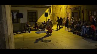 Some exotic dance outside Restaurante A Regueifa in Vigo Spain.    Galego is spoken here.