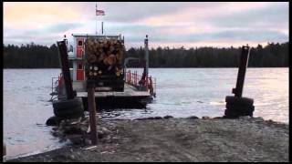 2011 12 01 barge arriving with loaded log truck in rough weather