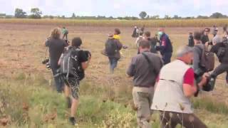 Hungarian camerawoman caught kicking migrant to sue him