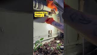 Plumber Repairs Leaking Outdoor Water Pipe