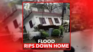 FLOOD RIPS DOWN HOME