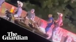 Video of police officer throwing man off bridge sparks outrage in Brazil