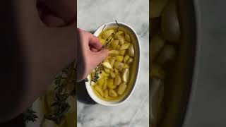 Roasting garlic cloves in olive oil allows them to become mild, caramelized, and tender
