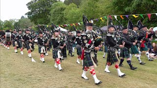 Pipe Bands playing Scotland the Brave on the march for the opening of 2022 Drumtochty Highland Games