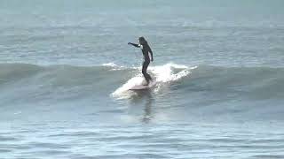 Surfing at Sumner Beach, Christchurch, New Zealand.