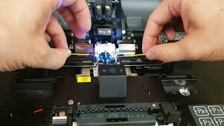 Splicing a broken optical fiber