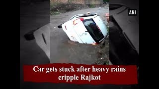 Car gets stuck after heavy rains cripple Rajkot