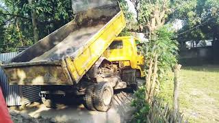 TATA LPK 909 Tipper Unloading Soil In Off Road.