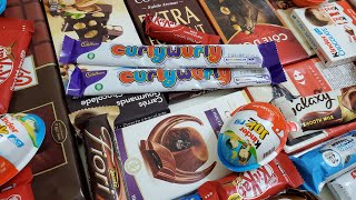 lots of candies opening ASMR. cadbury curlywurly