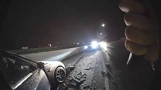 Highway patrol trooper narrowly avoids being hit on icy freeway