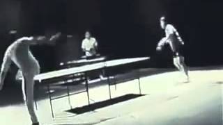 Bruce Lee playing ping-pong with nunchucks