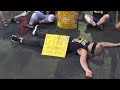 Israeli protesters scuffle with police during a protest in Tel Aviv