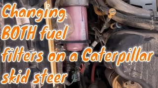 Caterpillar fuel filter change on a 259 d skid steer